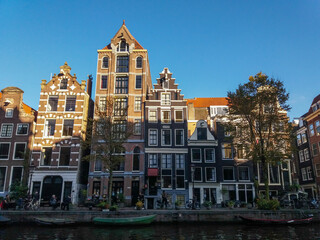 Singular architecture of Amsterdam, the most famous city of Netherlands. Small and big buildings completes this wonderful urban center.