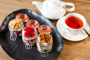Red sweet dessert on a white plate. Sweetness on a beautiful dish. Sweet cake