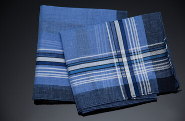 blue handkerchief with lines on the black background