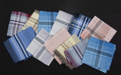 12  handkerchiefs with lines on the black  background