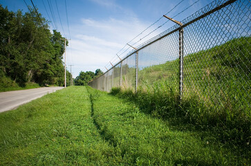 prison fence on country road