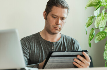 Man using tablet pc in the office.