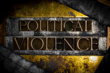 Political Violence text formed with real authentic typeset letters on vintage textured silver...