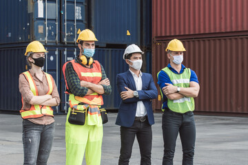 Portrait of caucasian and asian workers wearing masks