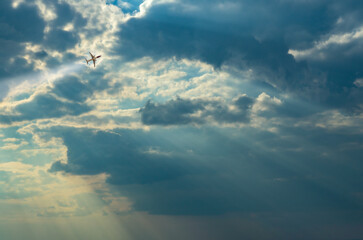 Sun beams or light rays breaking through the clouds.