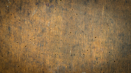 old brown board with traces of bark beetles