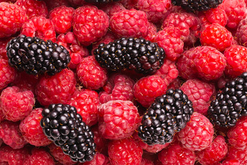 Tasty raspberry and blackberry background.