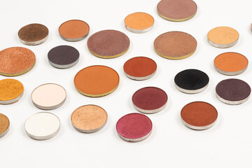 Round multicolored make up eyeshadows isolated on white.
