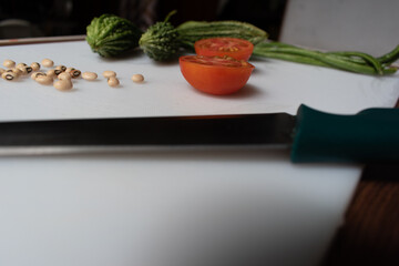 vintage style old salad with vegetables ingredients isolated on a plate .