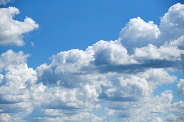 Naklejka na ściany i meble Many white clouds in the blue sky.