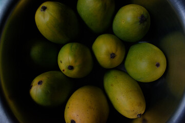 fruit cut by knife, the fruits with knife on plate.