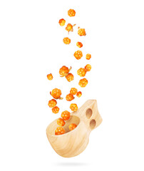 Cloudberries fly out from a wooden cup, isolated on a white background