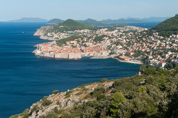 Fototapeta na wymiar Old pier of Dubrovnik with surrounding mountains and sea.