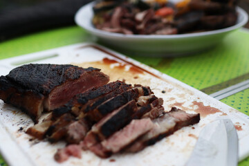 Sliced medium rare rib eye steak