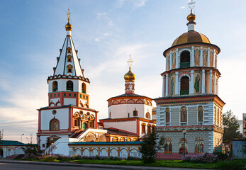 Fototapeta na wymiar Bogoyavlensky (Epiphany) Cathedral in the city of Irkutsk, Russia, built in the style of the Siberian Baroque, is the main cathedral of the Irkutsk Diocese