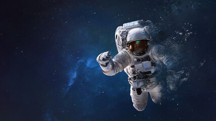 Fototapeta na wymiar Astronaut from dust in outer space. Space wallpaper. Elements of this image furnished by NASA