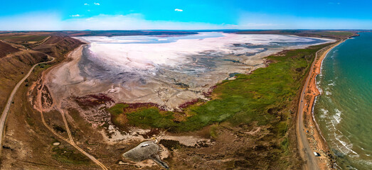 Tobechikskoe salt lake separated from the Black Sea by a sandy spit in the south of the Kerch Peninsula (Crimea, South of Russia) aerial drone panorama on a sunny summer day