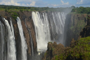 Naklejka premium The massive Victoria Falls waterfalls between Zimbabwe and Zambia in Southern Africa