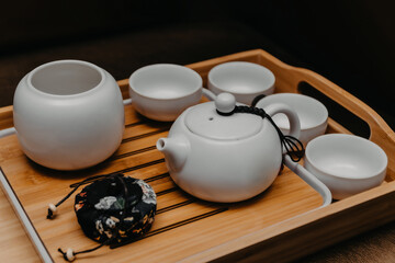 White sake drinking set on wooden tray.