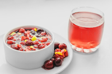 Fruit salad and juice on white background. Healthy breakfast concept.