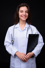 Portrait of young beautiful woman doctor with short hair