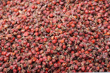 Natural background of dried rosehip fruit