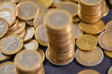 Stock Photo - Euro coins. Euro money. Euro currency.Coins stacked on each other in different positions. Money concept