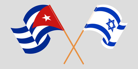 Crossed and waving flags of Cuba and Israel