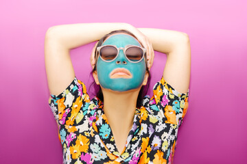 Woman with turquoise beauty mask
