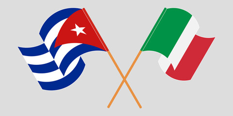 Crossed and waving flags of Cuba and Italy