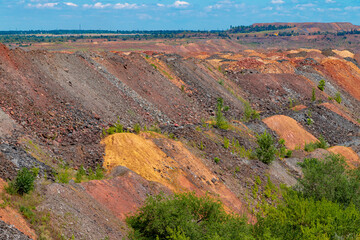Ukraine, Krivoy Rog, unique place called "Ukrainian Mars". Waste rocks create multicolored mosaic. Open mine site with rare earth materials.