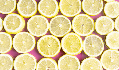 sliced lemons on a white background. round cut