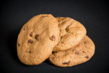 Chocolate chips cookies in a black background