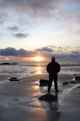 silhouette of a man on the beach, outer hebrides, scotland