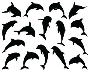 Black silhouettes of dolphins in jumping  on a white background