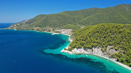 Fototapeta na wymiar Aerial drone photo of secluded turquoise paradise beaches only accessed by boat of Ftelia and Megalo Pefko covered with pine trees, Skopelos island, Sporades, Greece