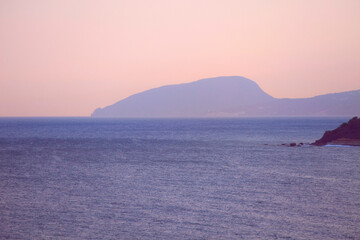 Seascape in Crimea with a view of the Bear Mountain after sunset