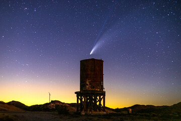 Comet NEOWISE C/2020 F3 over an old railroad water tower at Dos Cabezas siding in California.