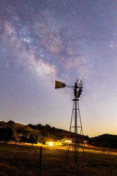 Milky Way galaxy and an old windmill on a farm in Ramona, California