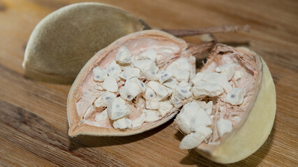 Large ripe cut baobab fruit with white flesh