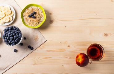 blueberries and porridge as morning healthy breakfast concept