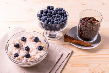blueberries and porridge as morning healthy breakfast concept