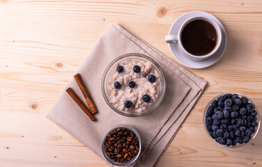 blueberries and porridge as morning healthy breakfast concept