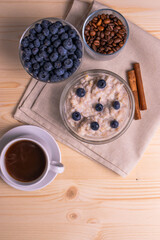 blueberries and porridge as morning healthy breakfast concept