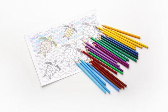 Coloring picture and pencils on white background