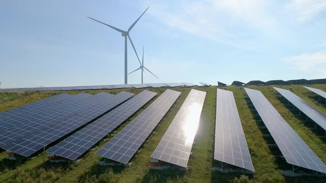 SLO MO AERIAL WS Solar panels and wind turbines in field / Geldermalsen, Gelderland, Netherlands
