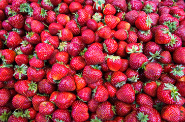 Fresh organic red ripe Strawberry fruit background closeup.