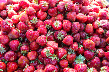 Fresh organic red ripe Strawberry fruit background closeup.