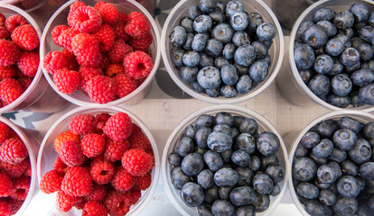 Red raspberry isolate. Group of fresh blueberries isolated.