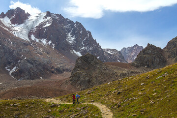 Couple hiking in the Ala Tau Mountains in Almaty, Kazakhstan.